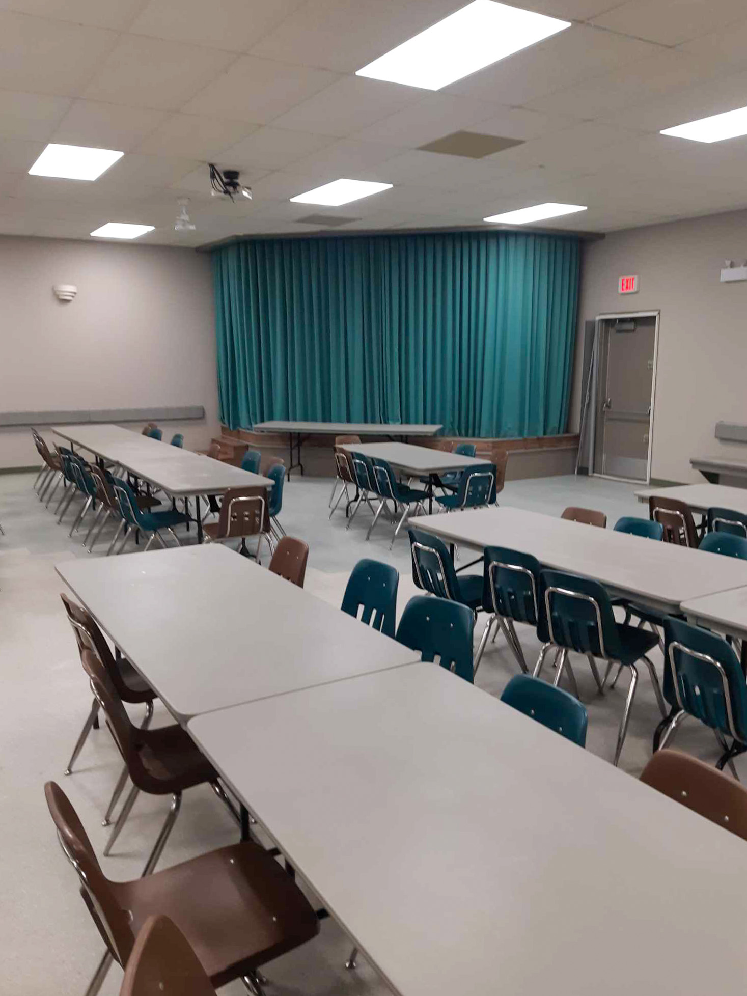 Hall interior stage and foldeing tables and chairs